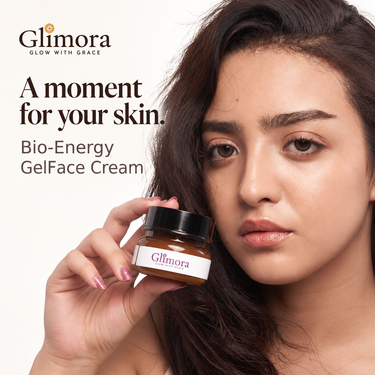 Model holding GLIMORA Bio-Energy GelFace Cream beside her face.