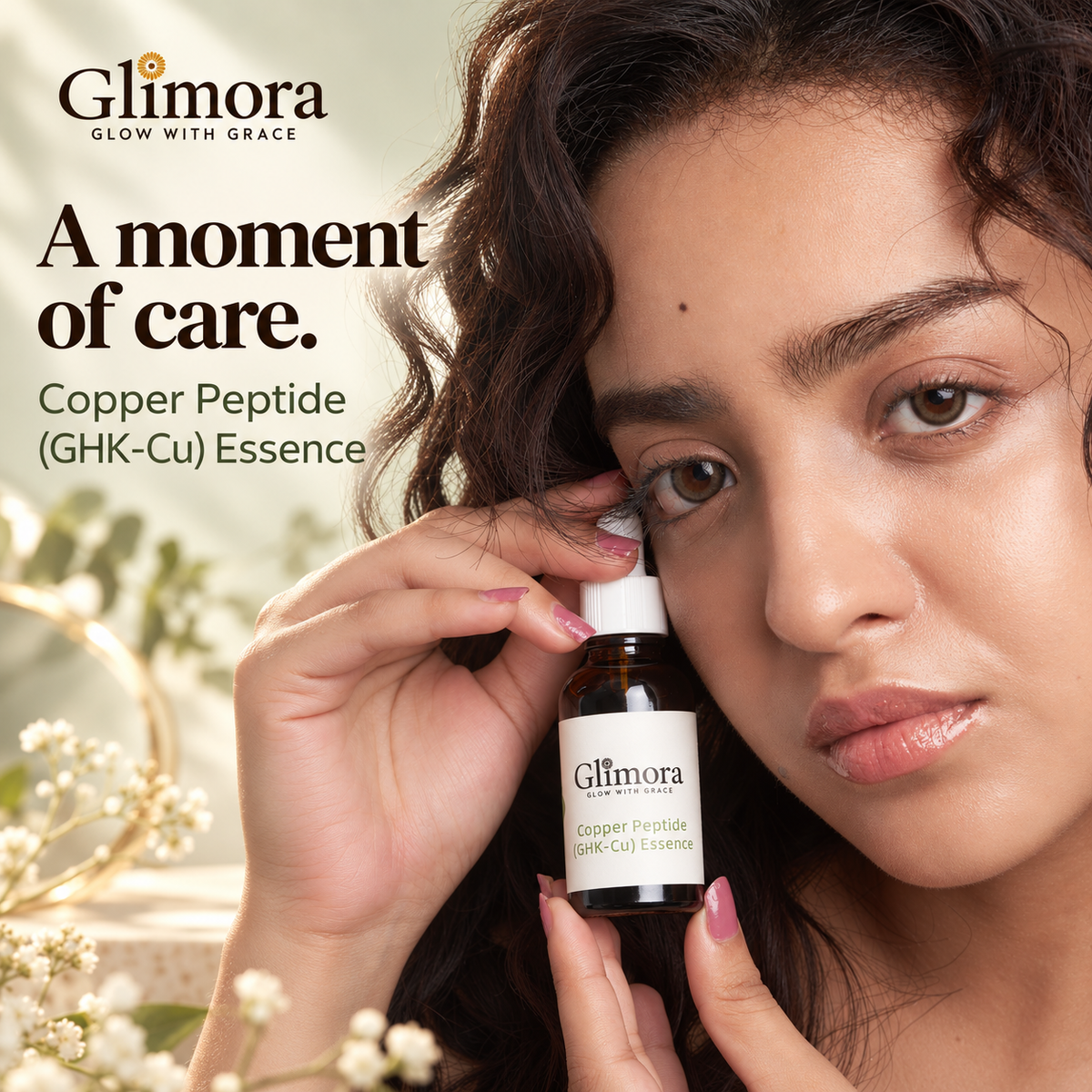Model holding GLIMORA Copper Peptide (GHK-Cu) Essence beside her face against a soft sage background.